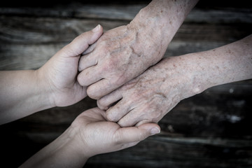 Young and old hands love and care