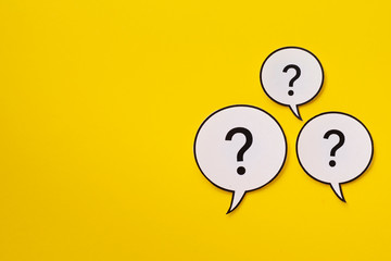 Three speech bubbles with question marks with copy space