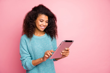Close-up portrait of her she nice attractive lovely charming cute cheerful cheery wavy-haired girl using wi-fi smart gadget reading news isolated over pink pastel color background