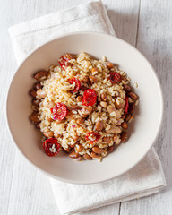 Rice with cannellini beans and dried tomatoes. Vegan food