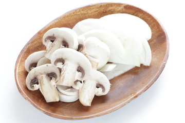 Fototapeta na wymiar Chopped mushroom and onion on wooden plate