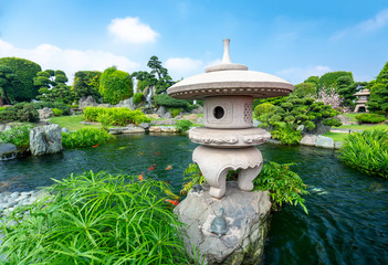 Fototapeta na wymiar Beautiful garden in ecotourism is designed harmony with cypress, pine, stone and ancient trees bearing traditional culture of traditional Japanese gardens.
