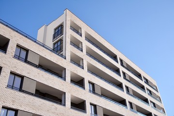 Modern and new apartment building. Multistoried modern, new and stylish living block of flats.