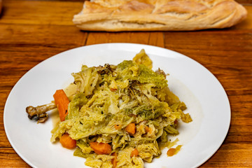 Braised guinea fowl with cabbage.