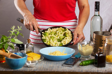 Cooking Pasta Elbow macaroni with broccoli