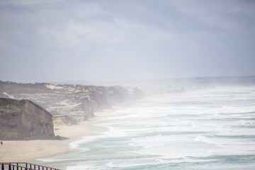 Full view at the Foz do Arelho beach, wild atlantic ocean coast and huge cliffs