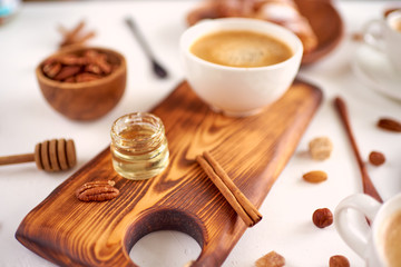 breakfast pattern, coffee, honey, cinnamon sticks, nuts, sugar. Good morning concept.