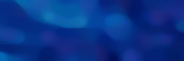 blurred bokeh horizontal background with midnight blue and strong blue colors and space for text