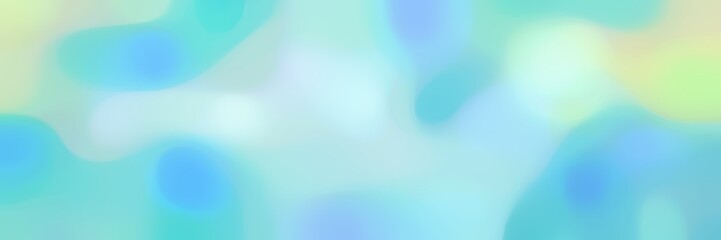 blurred bokeh horizontal background with sky blue, light blue and medium turquoise colors and space for text