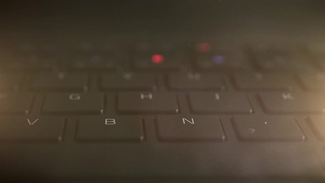 illuminated keyboard buttons letters in multiple RGB colors on modern