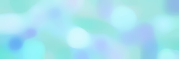 blurred horizontal background with pale turquoise, light blue and light cyan colors and space for text or image