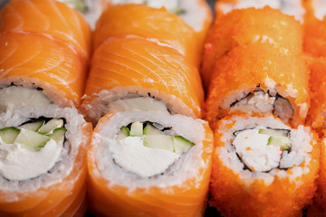 Detail of a california maki and philadelphia rolls in bento box