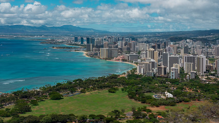 Panoramic vistas from Diamond Head view point towards Waikiki Beach, beachfront lined with towering hotels and holiday accommodation, exquisite restaurants and shops, Honolulu, Oahu Island, Hawaii, US