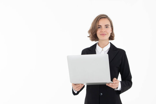 Portrait of young business woman holding laptop with hand pointing up , isolated on white background