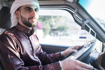 Young Arab man driving