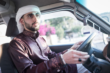 Young Arab man driving