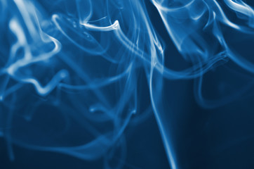 The smoke from the incense sticks. Abstract art. Soft focus. Color of the year 2020 Classic Blue. - Image