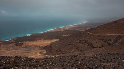 Ethereal landscape of Playa de Cofete, as seen from a high up viewpoint, barren, volcanic landscape, reached only by off road vehicles or by trekking, Morro Jable, Fuerteventura, Canary Islands, Spain