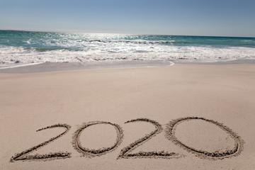 Beach holiday with 2020 in the sand