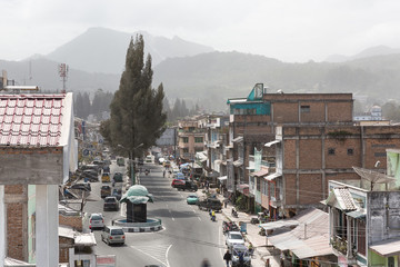 Beautiful cityscape of Berastagi, Sumatra, with a volcanic ash covered landscape by volcano Mount...
