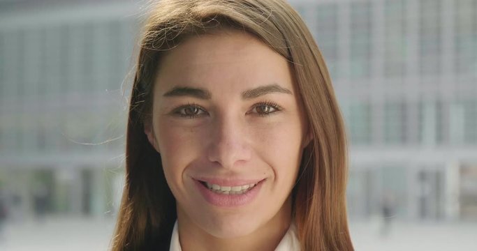Mix of people of different ethnicity, sex and age are smiling in camera.