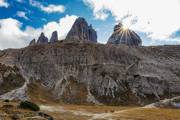 Stunning view of rocky mountains and cloudy sky in Tre Cime di Lavaredo park in Italy