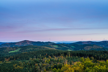 Germany, Aerial view above beautiful paradise like untouched natural black forest nature landscape, above tree tops at sunset in autumn