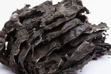 Ashes from burning paper, white background