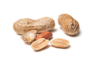 closeup of organic peanuts on white background