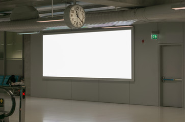 Large billboards are empty at the airport.