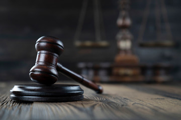 Law concept. Judge’s gavel and scale on dark background.