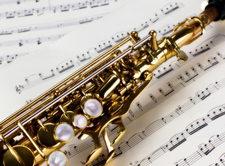 Soprano Saxophone Close Up over musical notes