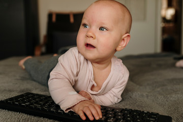 mall child grabs a mouse and keyboard, internet addiction from an early age