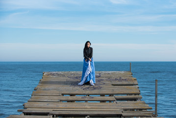 Beautiful woman on the pier