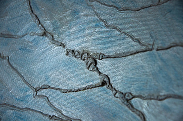 Modern art abstract pattern of curved lines oil paints on a gray metallic background