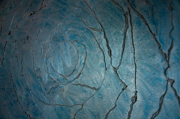 Modern art abstract pattern of curved lines oil paints on a gray metallic background