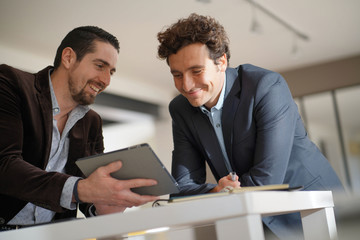 Business people meeting for work in lobby