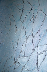 Modern art abstract pattern of curved lines oil paints on gray metallic background