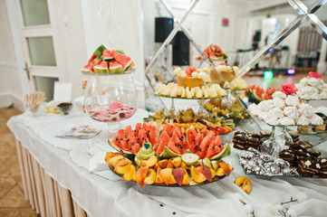 Dessert table of delicious fruits on wedding reception.