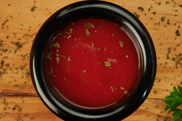 Bowl with ketchup and herbs