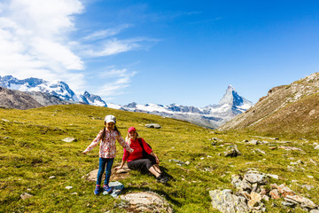 Fototapeta premium Family trekking, mother and daughter camping