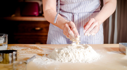 chef kneads baking dough, dirty chef hands in pastry, cooking, bakery concept