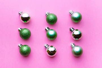 Xmas balls isolated on pink background. Christmas bubble pattern decoration. Flat lay. Winter concept