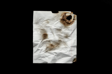 top view of empty white crumpled and burnt vintage paper isolated on black