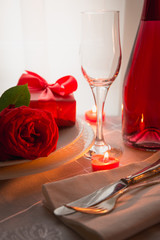 Festive or romantic dinner with red rose and champagne. Valentine day.