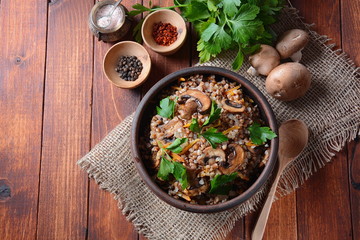 Buckwheat porridge with mushrooms in a bowl. Vegan , gluten-free. Russian or Ukranian cuisine. Healthy food concept