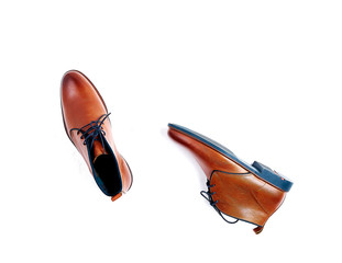 luxurious male brown and blue leather shoes isolated on a white