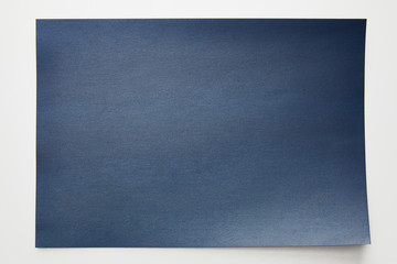top view of striped empty blue paper on white background