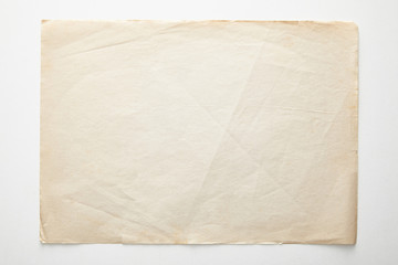 top view of empty vintage paper on white background