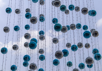 Blue and silver balls hung for decoration during the festive season, looking at the background
